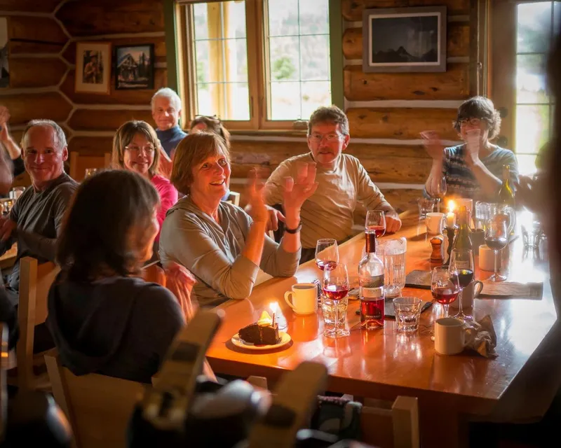 Guests celebrating at dinner table