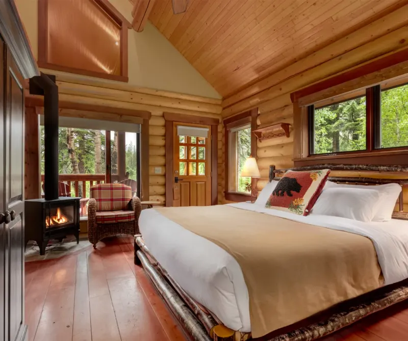 Cathedral King Cabin interior with stone fireplace and mountain views