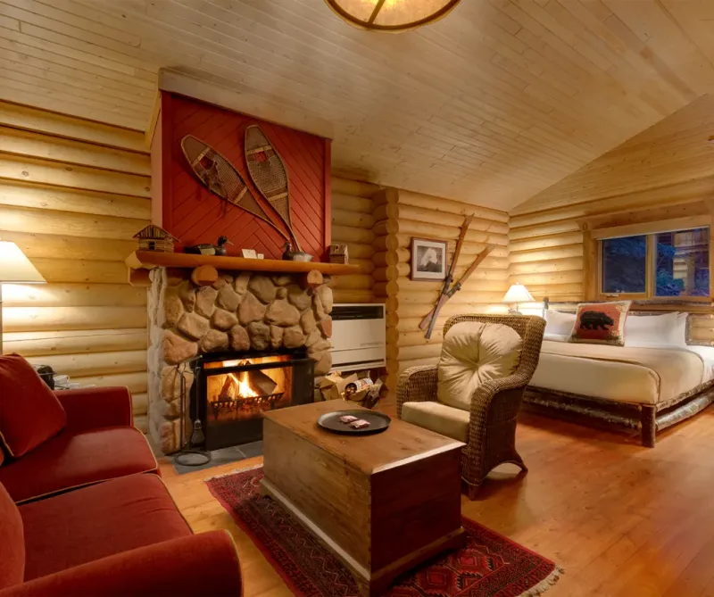 Premier Cabin interior with king bed and rustic log cabin decor