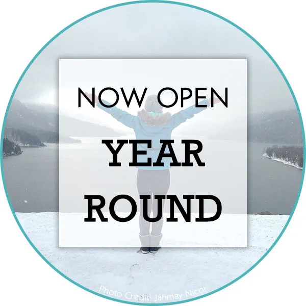 Couple relaxing on Crandell's patio enjoying mountain atmosphere