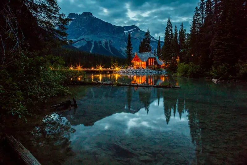 Evening view of Emerald Lake with lodge lights