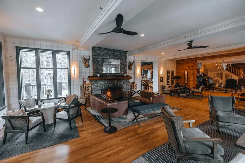 Main lodge lobby with century-old fireplace