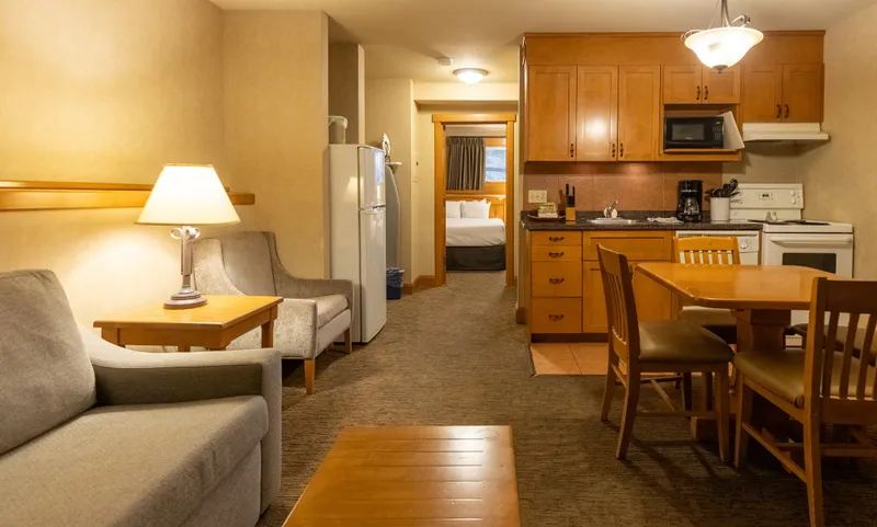 One-bedroom condo at Hidden Ridge Resort with wood cabinetry, open living and kitchen space.