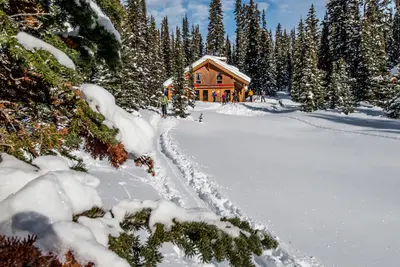 Mistaya Lodge exterior in mountain setting