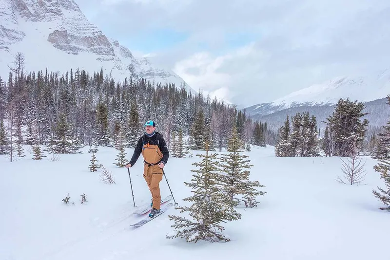 Backcountry skiing in Skoki Valley with mountain views